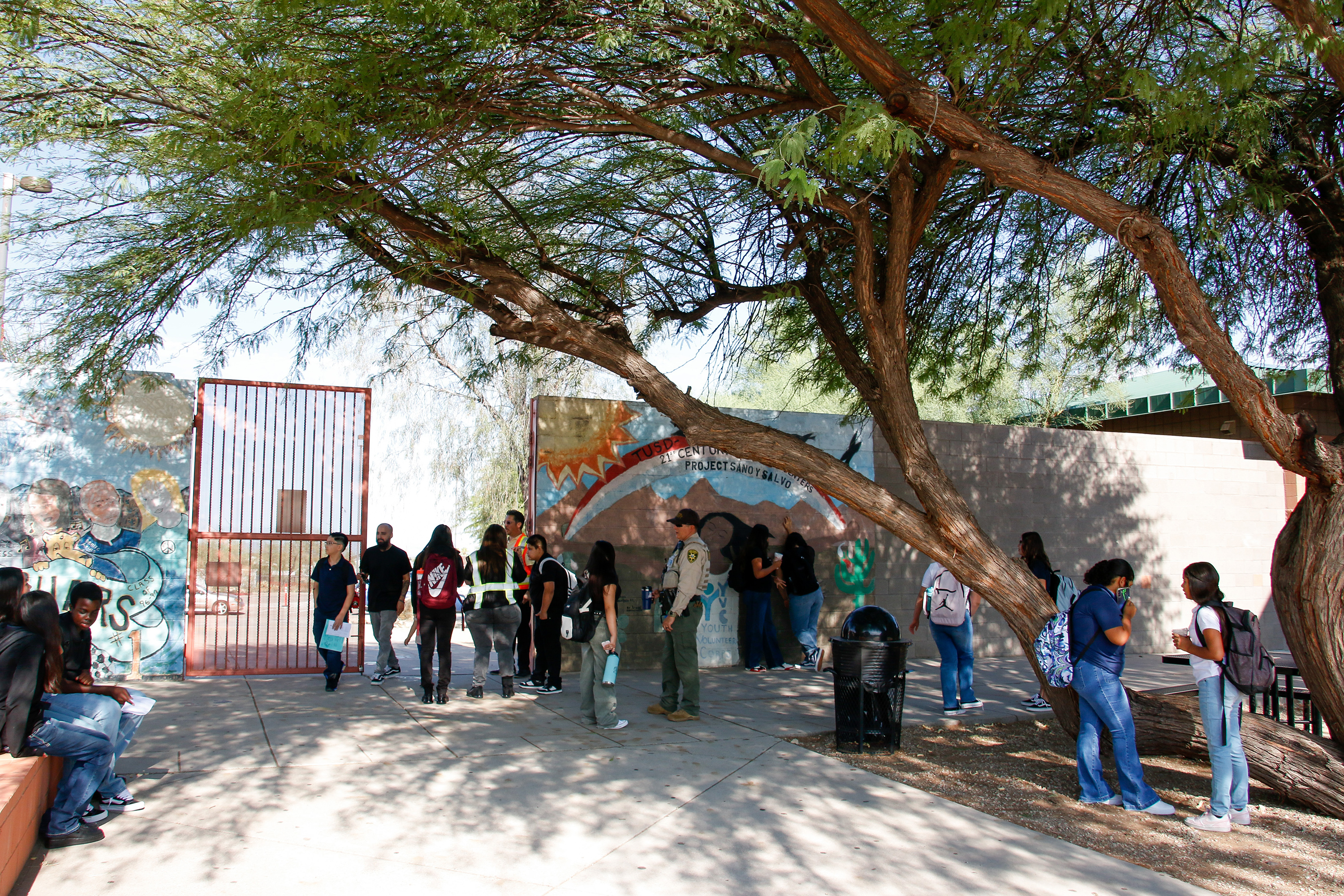 Students walk around outside on the first day of school