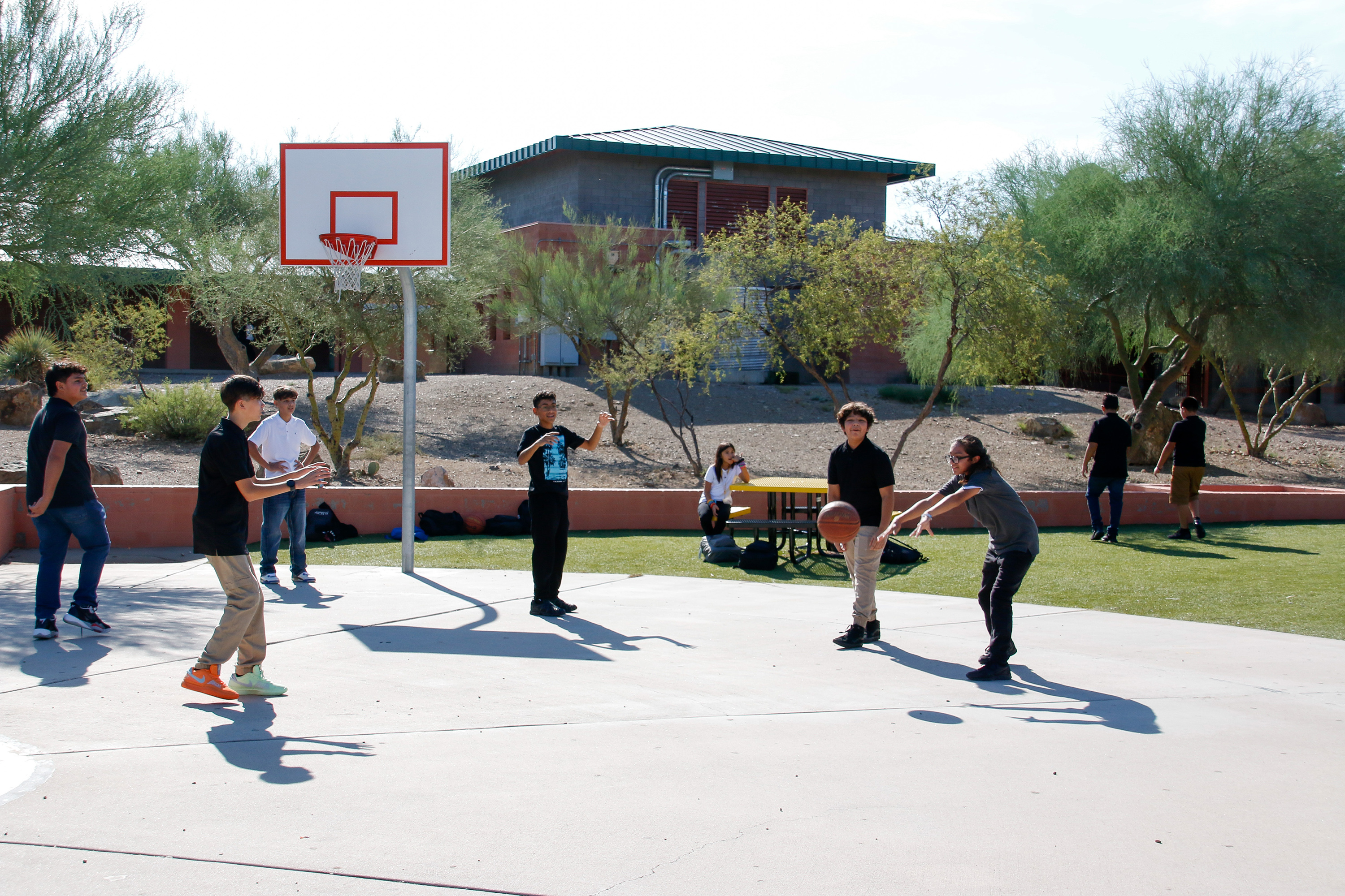 Valencia students play basketball on the first day of school